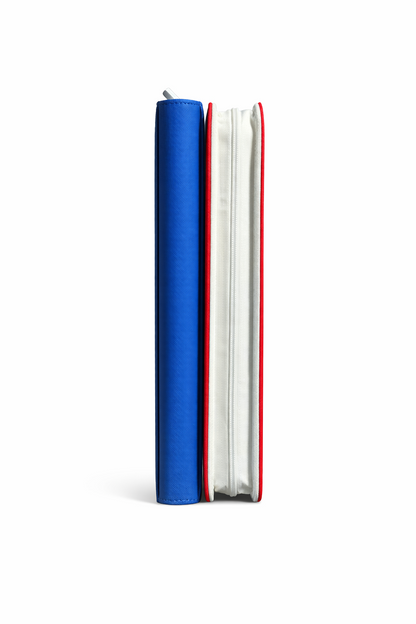 Two notebooks, one red and white, the other blue, stacked on a white background